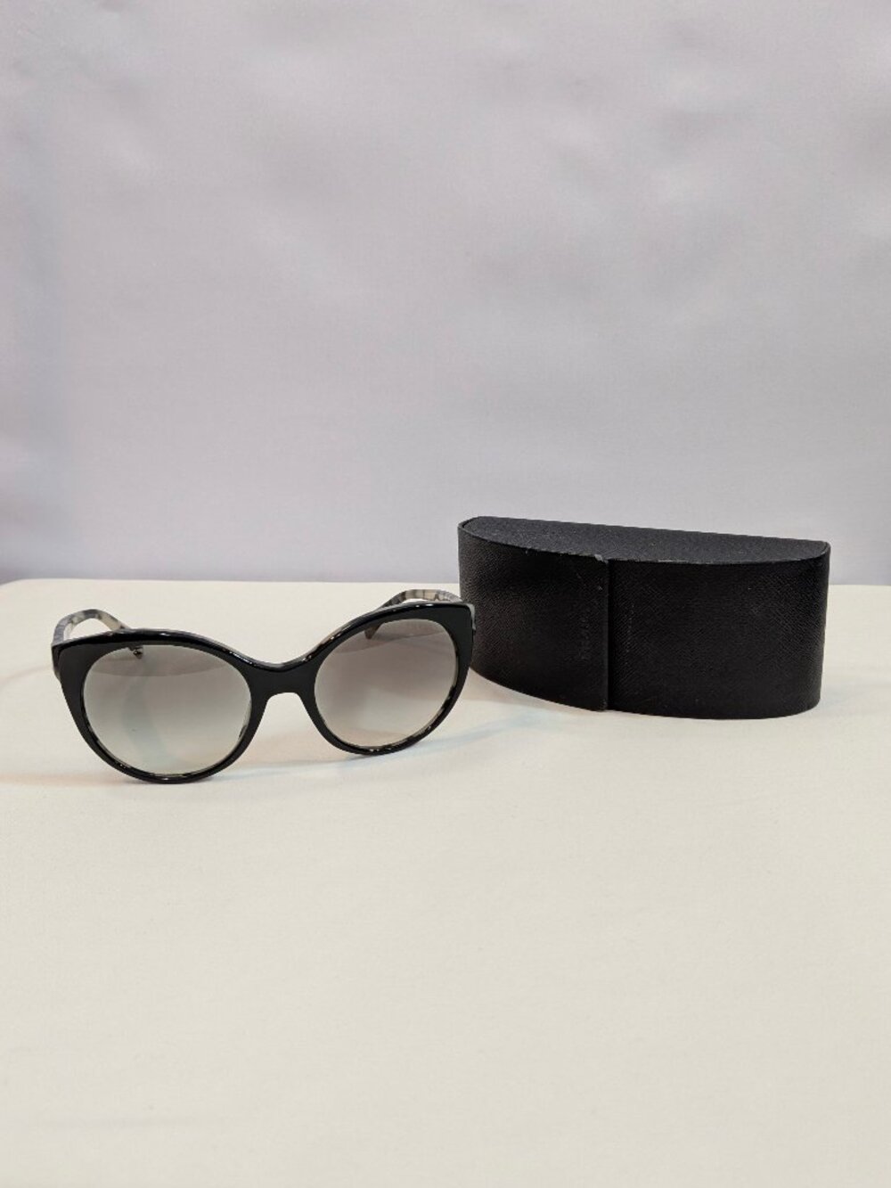 Prada SPR23O Black and Ivory Marble Cat-Eye Sunglasses with Gray Gradient Lenses